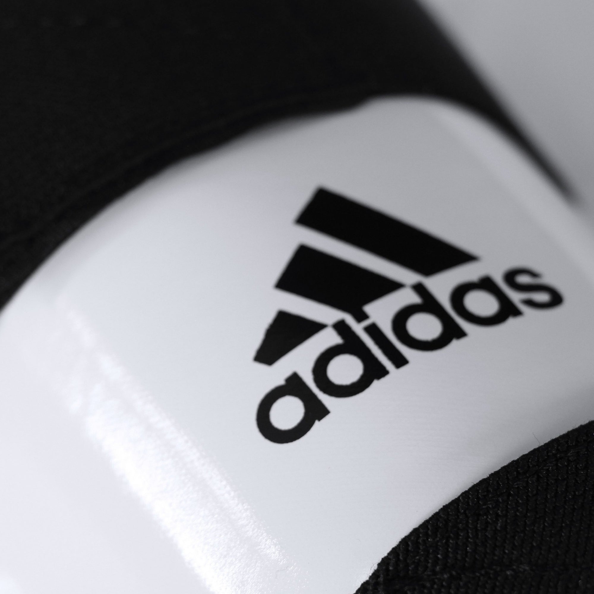 Close-up view of a logo on a taekwondo sock.