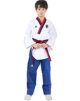 Boy wearing Adidas Poomsae taekwondo uniform in white and blue.