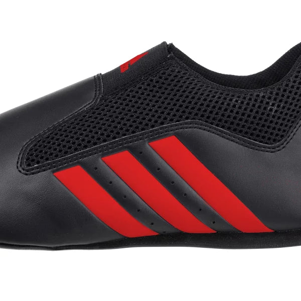 Black and red adidas laceless taekwondo shoe.