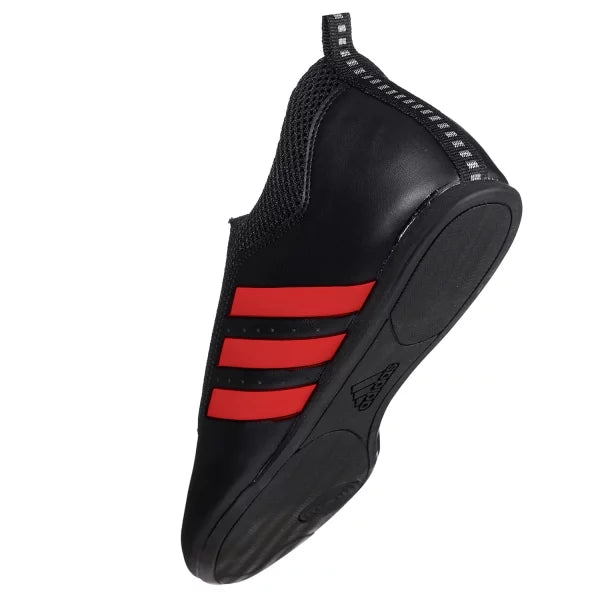 Black and red adidas laceless taekwondo shoe.