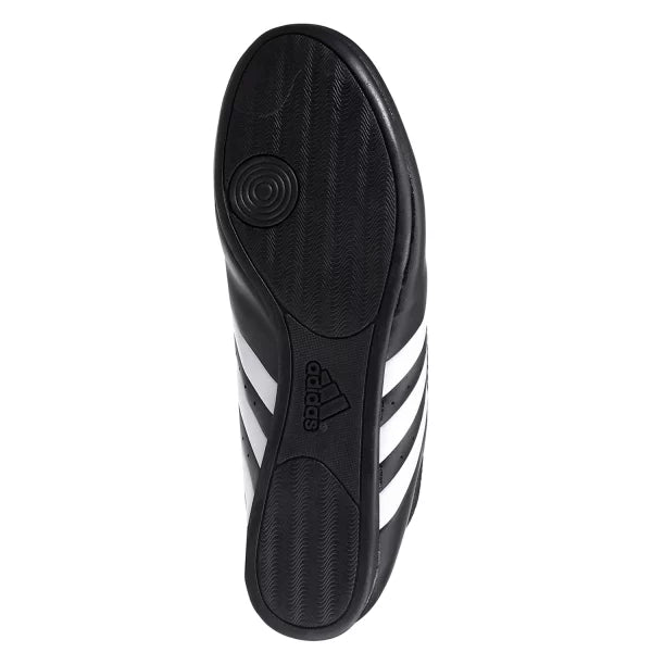 Black and white Taekwondo shoe with laceless design.