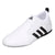 White adidas taekwondo shoe with black stripes.