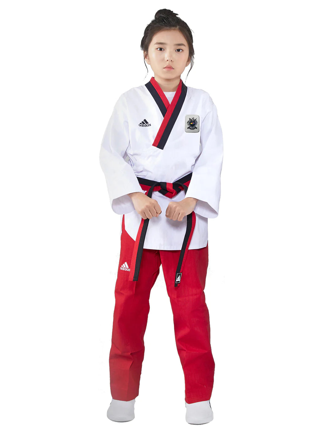 Girl in a white and red Adidas Poomsae karate uniform.