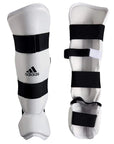 Pair of Adidas vinyl shin and instep guards in white and black.