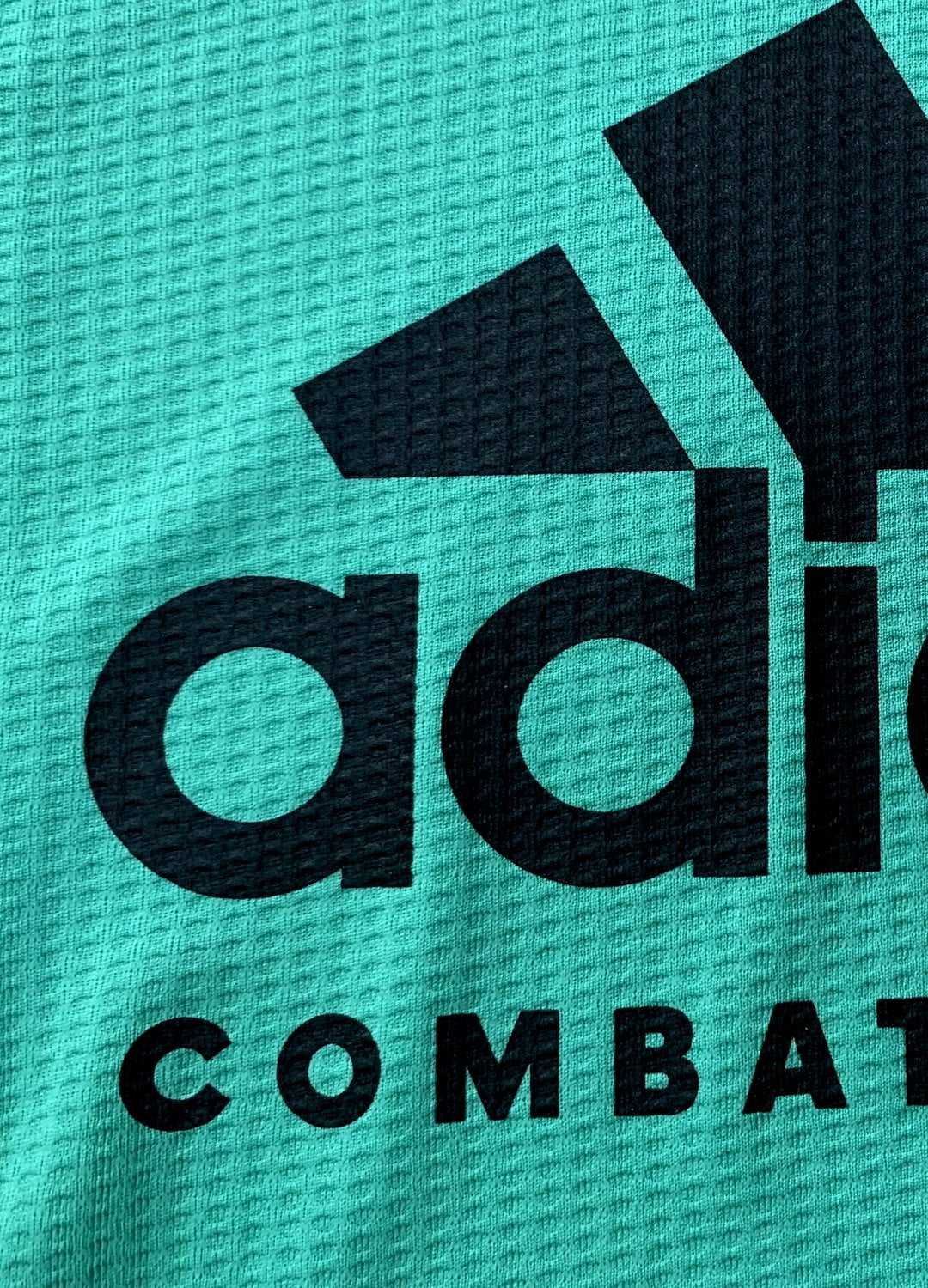 Close-up of Adidas logo on teamwear.