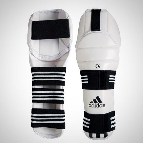 White and black Adidas vinyl shin and knee guard for Taekwondo protective equipment.