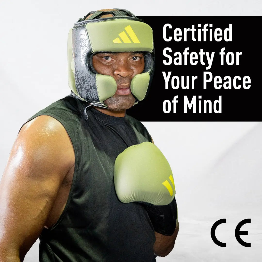 Man wearing boxing gloves, Adidas x Anderson Silva product photo.