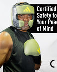 Man wearing boxing gloves, Adidas x Anderson Silva product photo.