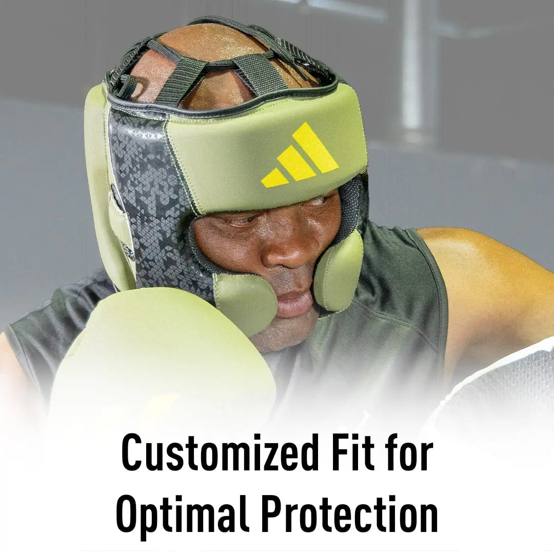 Man wearing boxing helmet for protection.