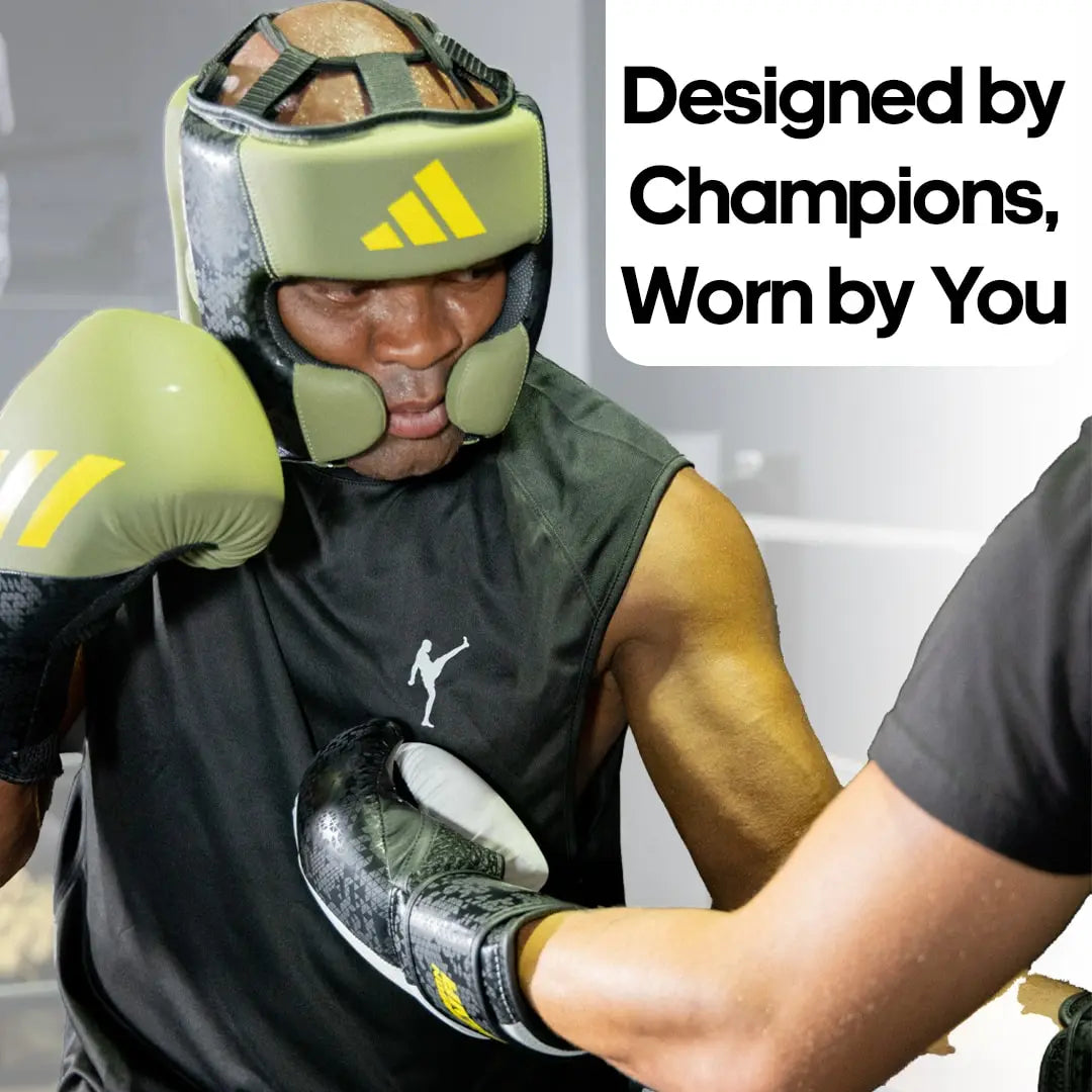 Man wearing boxing gloves, Adidas x Anderson Silva head guard product.