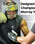 Man wearing boxing gloves, Adidas x Anderson Silva head guard product.