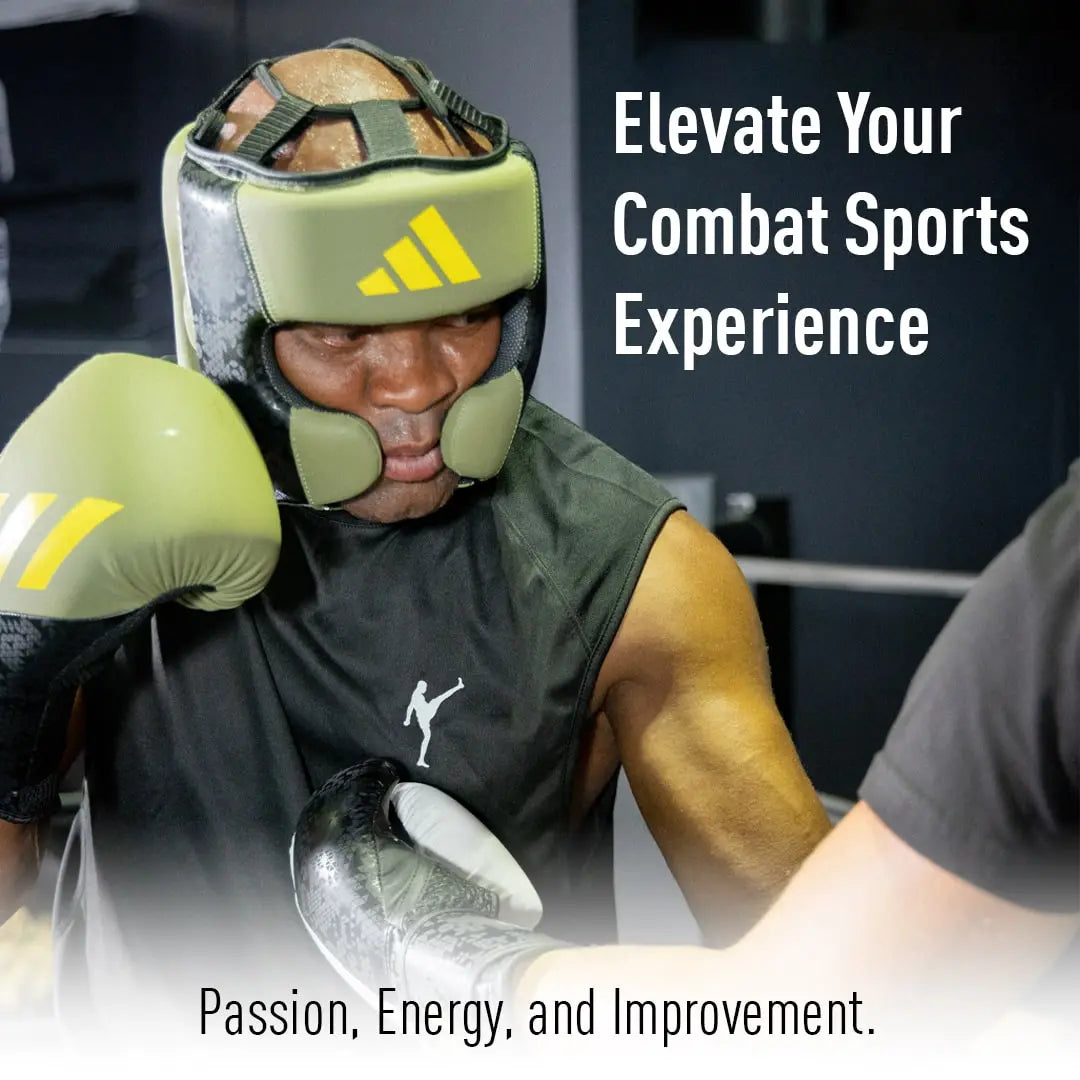 A man wearing boxing gloves showcases boxing equipment.