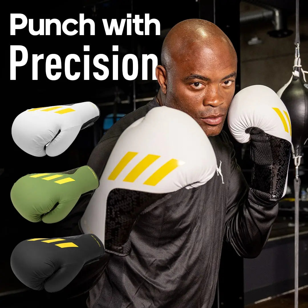 A man wearing Adidas x Anderson Silva Tilt150 boxing gloves.