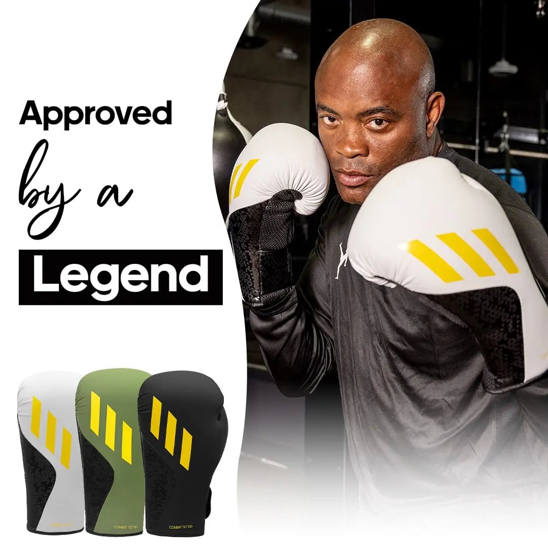 A man wearing Adidas x Anderson Silva Tilt150 boxing gloves.