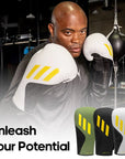 A man wearing Adidas x Anderson Silva Tilt150 boxing gloves.