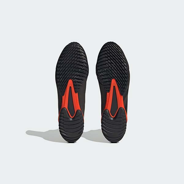 Black and red soles of Speedex 23 boxing shoes.