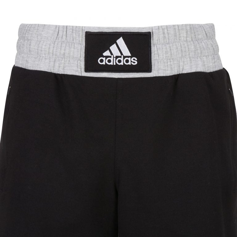 Black and grey adidas boxing shorts with logo, size L.