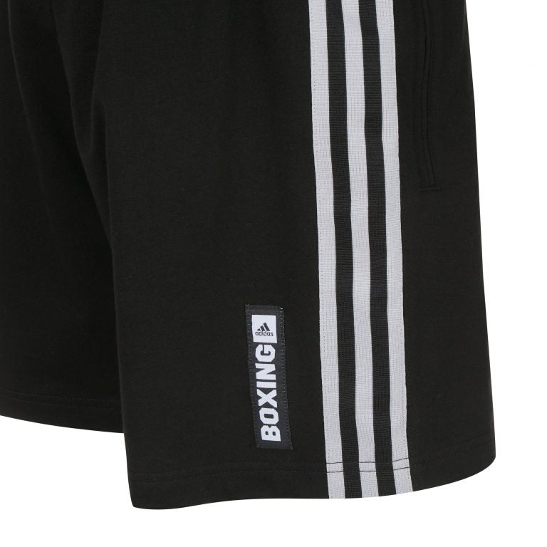 Close-up of ADIDAS traditional boxing shorts in black and white.