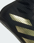 Close-up of Box Hog 4 black shoe with gold and grey accents.