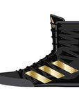 Black and gold boxing shoe lateral view.