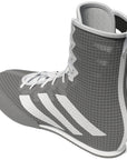 Grey and white high top shoe for boxing.