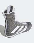 Grey and white high top shoe for boxing.