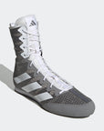 Grey and white sneaker featuring boxing shoe design.