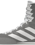 Grey and white high top boxing shoe, side view.