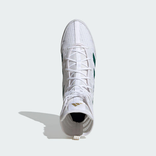 White high-top sneaker with green accents on a light gray background