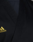 Black karate uniform with yellow logo from Adidas.