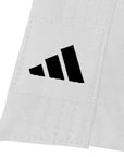 Close-up of a white fabric with black Adidas logo on a white background
