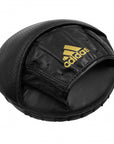 Black leather beanie with logo, boxing equipment.