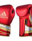 Pair of red boxing gloves from adidas Adi-Speed 501 for pros, 14 oz, in white, blue, red color scheme.