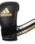 Black boxing glove with gold accents, 10 oz, for men and women.