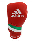 A red adidas boxing glove with white stripes.