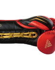 Red and black adidas Speed Tilt 750 fight glove.