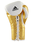 Gold boxing glove with white laces.