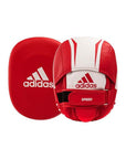 Red and white boxing mitt by Adidas for coaching.