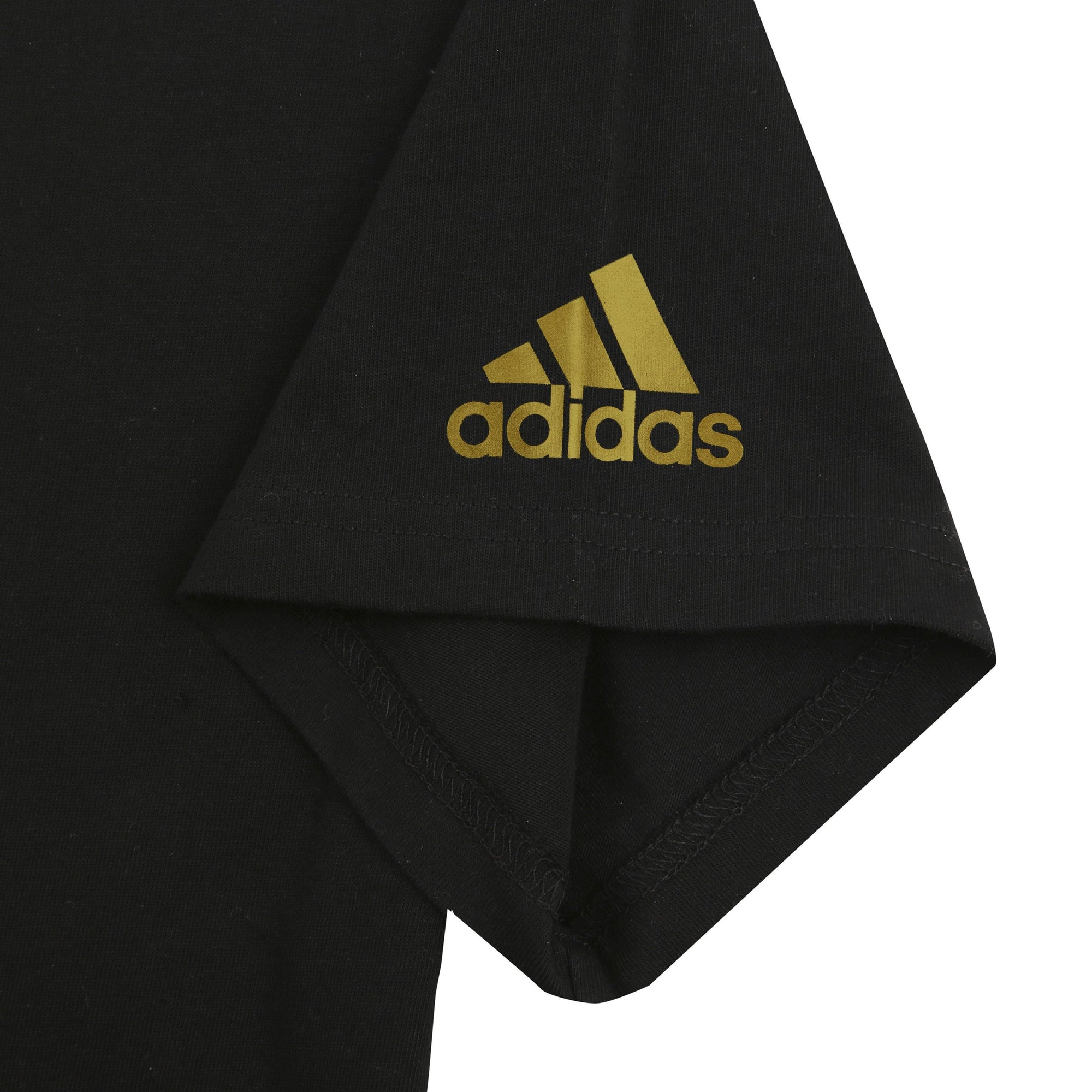 Black shirt with gold logo, close-up view.