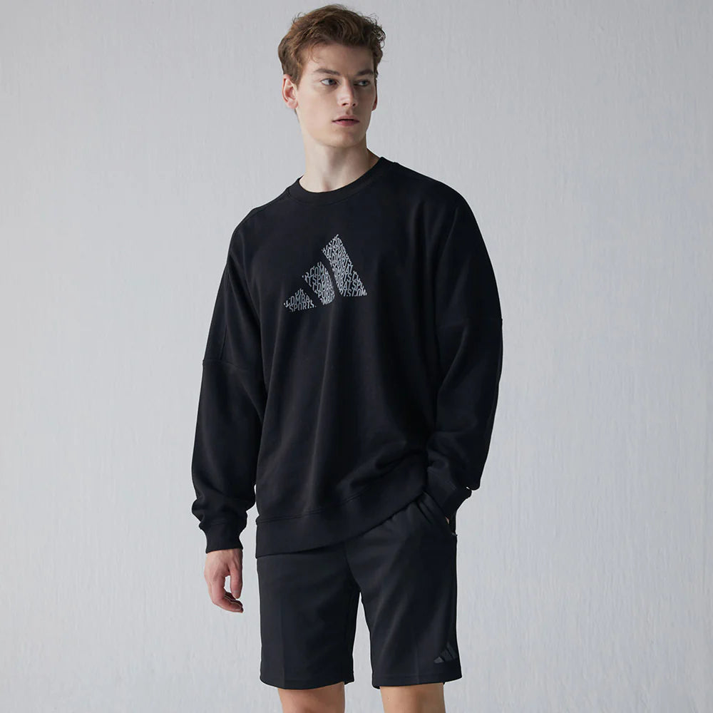 Man wearing black sweatshirt, part of taekwondo apparel.