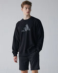 Man wearing black sweatshirt, part of taekwondo apparel.