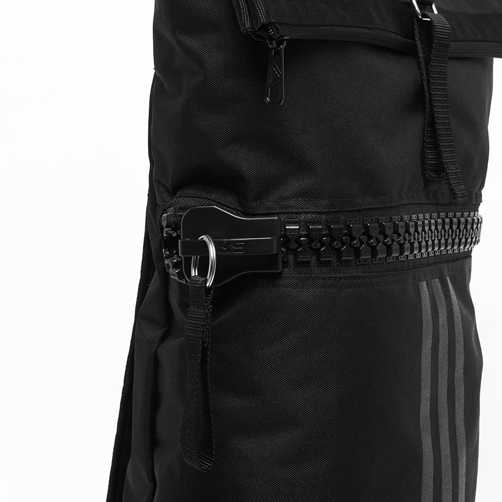 Black bag with zippers, close-up of adidas camo military sack bag.