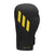 Black and yellow Adidas x Anderson Silva Tilt150 boxing glove.