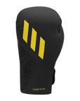 Black and yellow Adidas x Anderson Silva Tilt150 boxing glove.