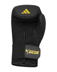 Adidas x Anderson Silva black boxing glove with yellow logo, 14 oz size.