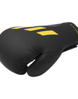 Black boxing glove with yellow stripes, Adidas x Anderson Silva collection.