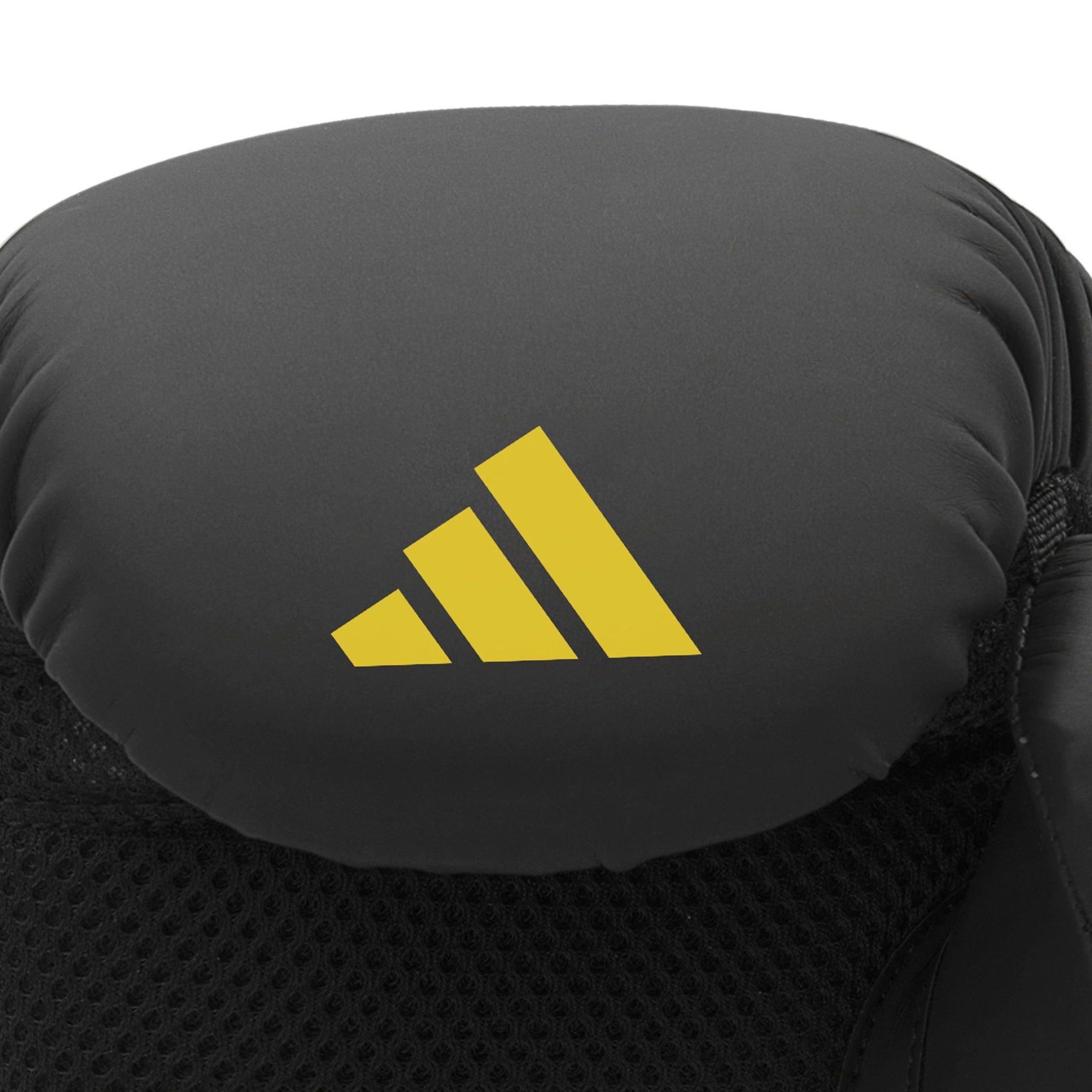 Close-up of Adidas x Anderson Silva black boxing glove, yellow logo, 16 oz size.