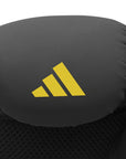 Close-up of Adidas x Anderson Silva black boxing glove, yellow logo, 16 oz size.