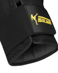 Black Adidas boxing glove with yellow logo.