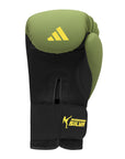 Green and black boxing glove by Adidas x Anderson Silva.